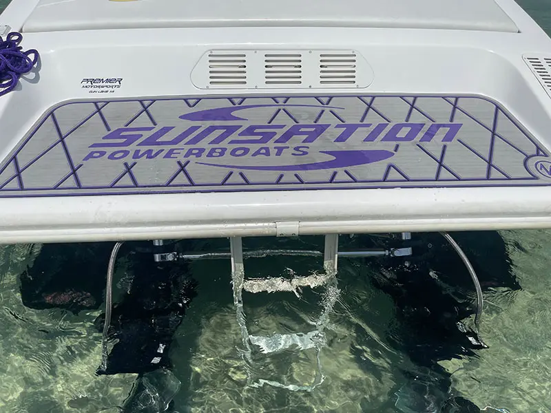 A boat with the words " caution power boats ".
