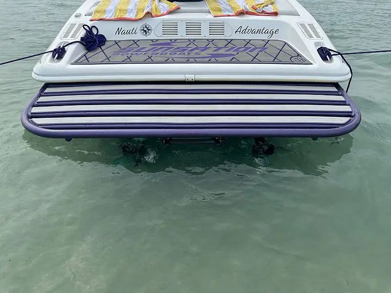 A boat is floating on the water in the ocean.